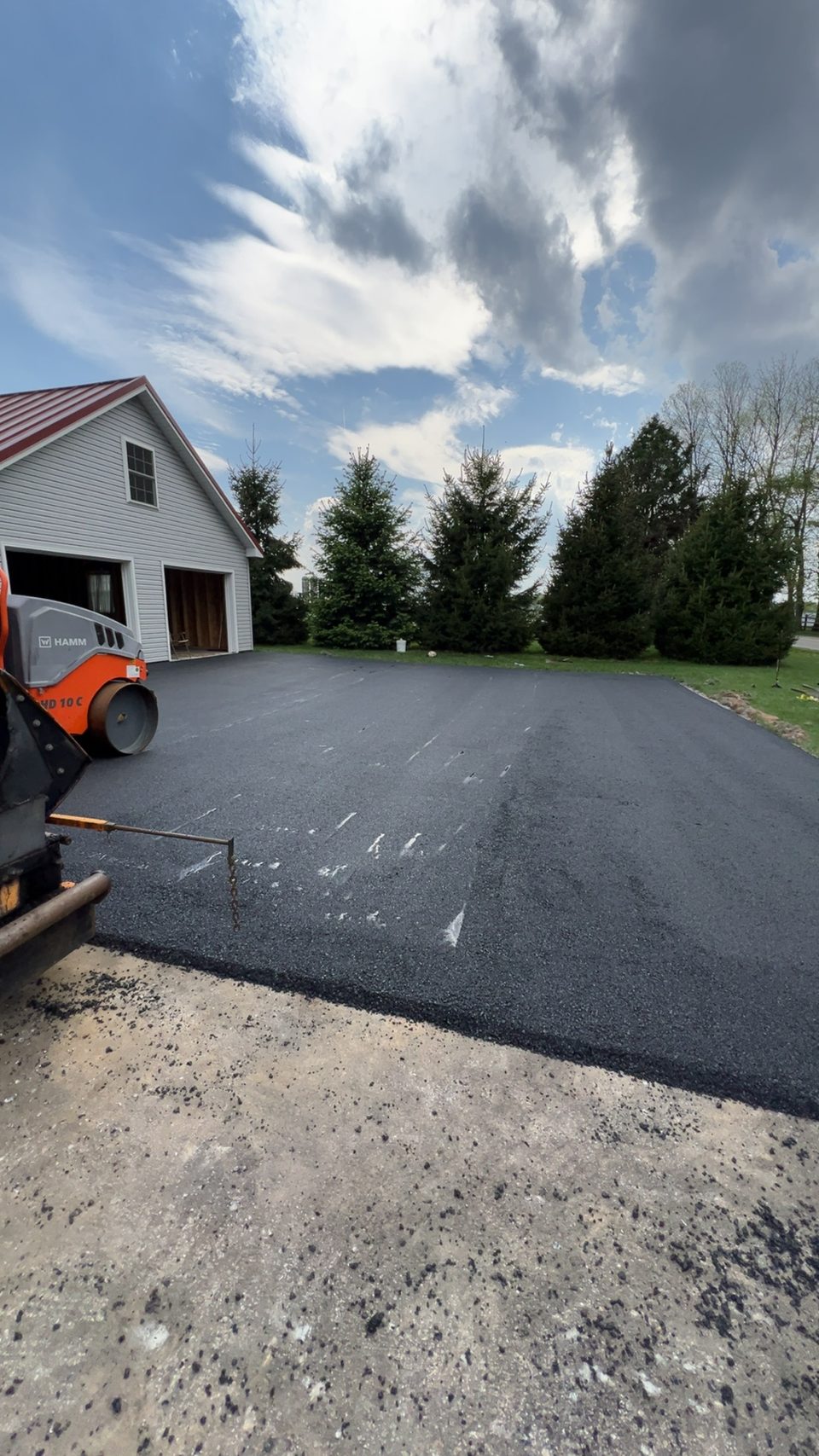 Asphalt paver laying a fresh mat in New Hampshire