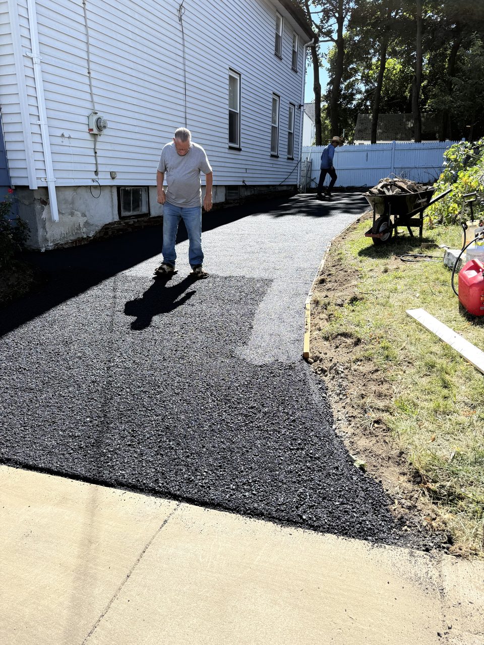Checking the finish on freshly laid asphalt